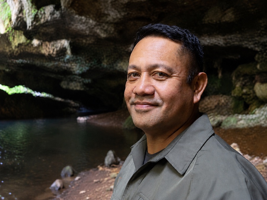 Hemi Williams, Waitomo cave guide, photographed at a limestone cave mouth in the Waitomo district